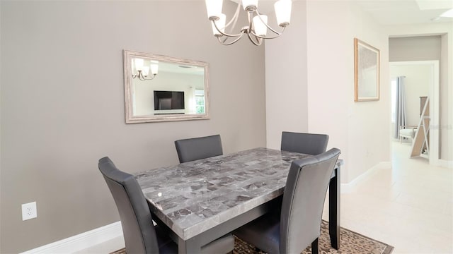 dining space featuring an inviting chandelier