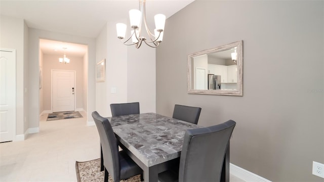 4326 Tamarind Pl, Bradenton, FL 34203 - dining space featuring a chandelier and baseboards