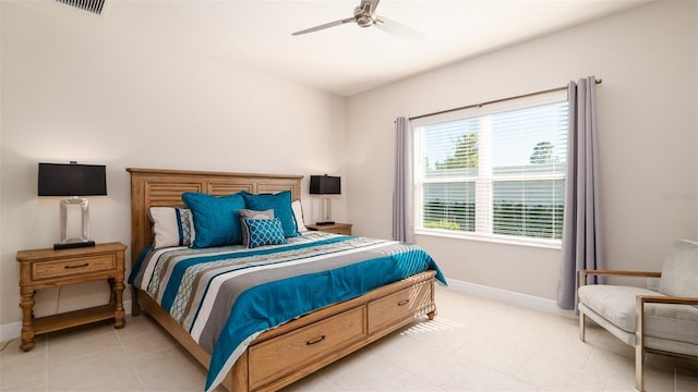 bedroom featuring light tile patterned floors and ceiling fan