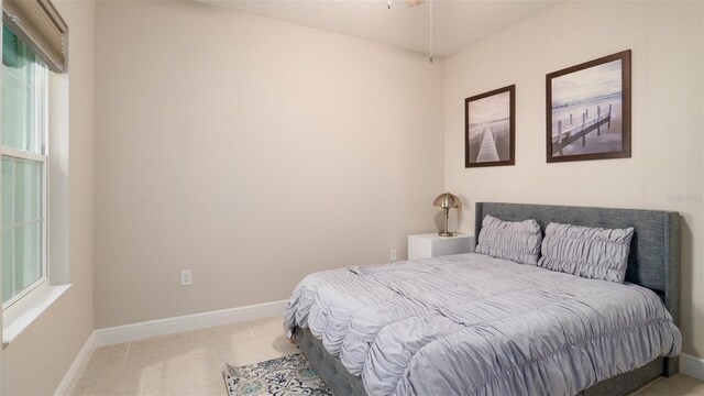 4326 Tamarind Pl, Bradenton, FL 34203 - bedroom featuring multiple windows and baseboards