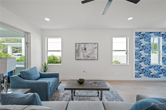 living room with light wood-type flooring and a healthy amount of sunlight