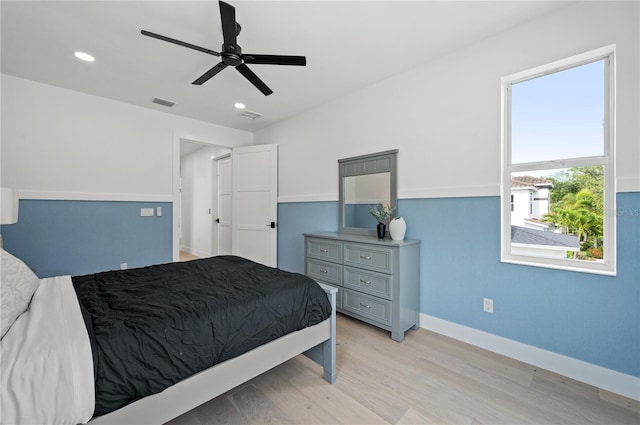 bedroom featuring ceiling fan and light hardwood / wood-style flooring