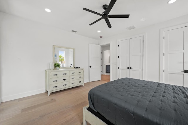 bedroom with ceiling fan and light wood-type flooring