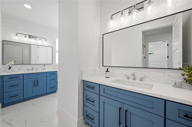 bathroom with decorative backsplash and vanity