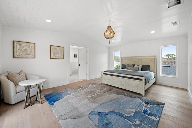 bedroom with wood ceiling, lofted ceiling, light wood-type flooring, and connected bathroom