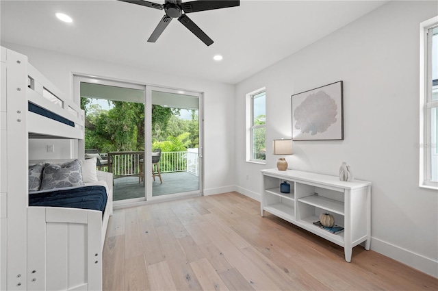 doorway to outside featuring ceiling fan and light wood-type flooring