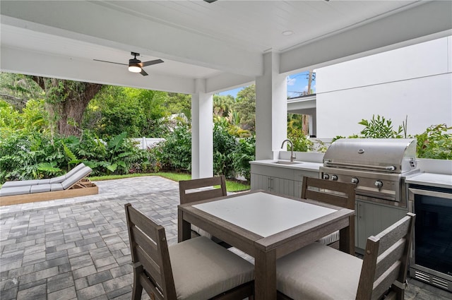 view of patio / terrace featuring ceiling fan, area for grilling, grilling area, and sink