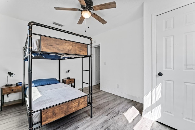 bedroom featuring ceiling fan and light hardwood / wood-style flooring