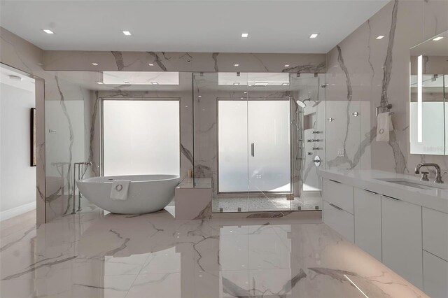 415 L Ambiance Dr Unit A801, Longboat Key, FL 34228 - full bathroom featuring marble tiled flooring, a marble finish shower, vanity, a freestanding bath, and recessed lighting