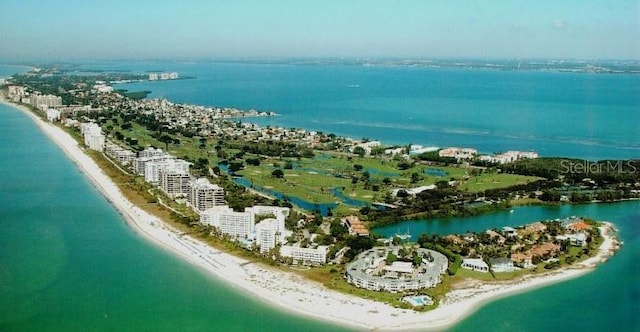 aerial view with a water view and a view of the beach