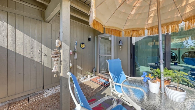 view of patio / terrace featuring washing machine and dryer