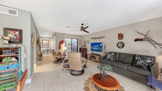 living room with ceiling fan and light tile patterned flooring