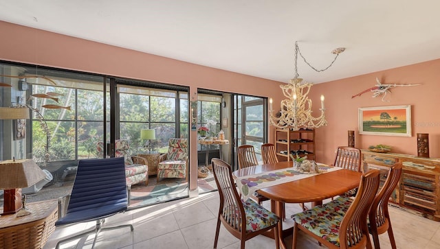 tiled dining space with a notable chandelier