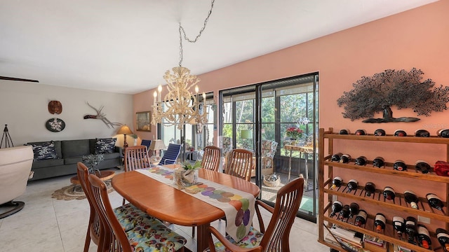 tiled dining area with a notable chandelier