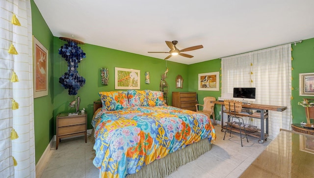 bedroom with ceiling fan and light tile patterned floors