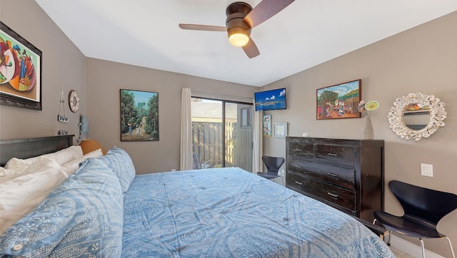 bedroom with ceiling fan, lofted ceiling, and access to outside