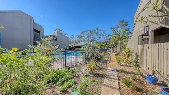 view of yard with a fenced in pool