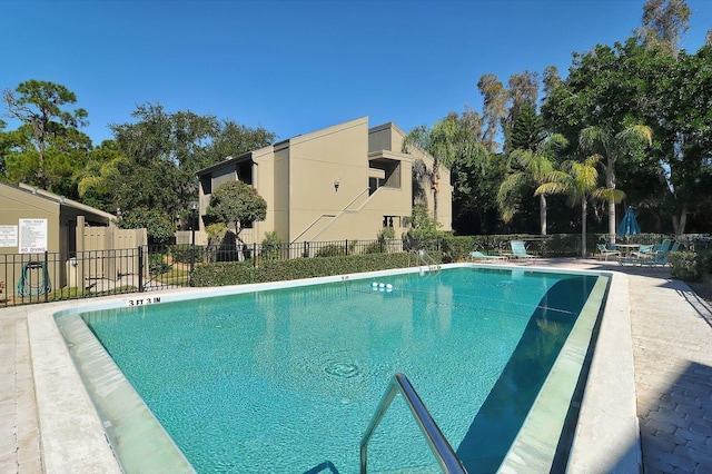 view of swimming pool featuring a patio area