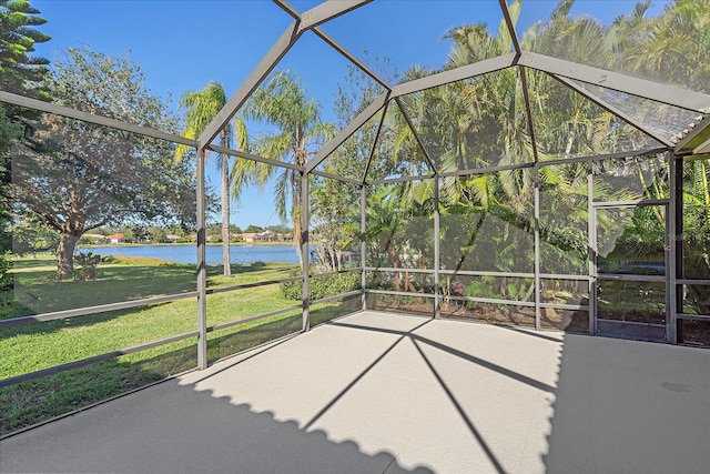 unfurnished sunroom with a water view