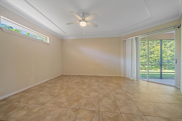 tiled empty room with ceiling fan and crown molding