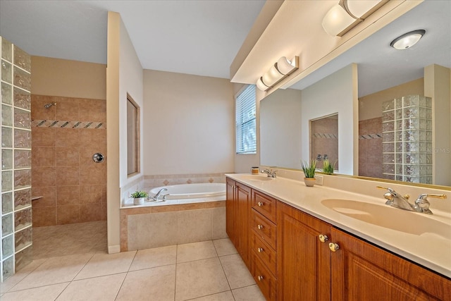 bathroom with shower with separate bathtub, tile patterned floors, and vanity