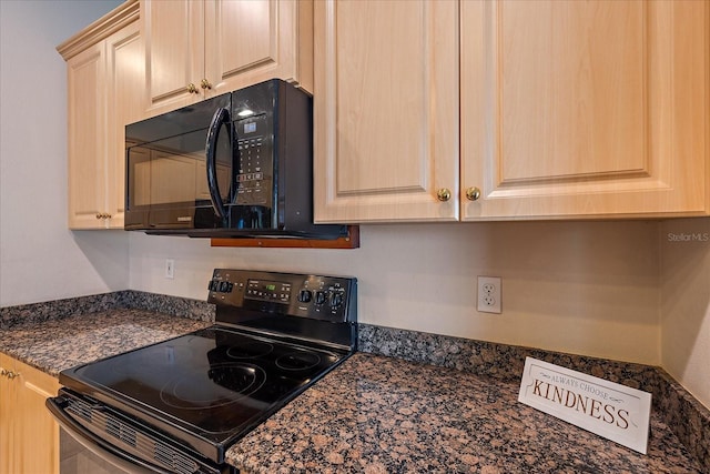 kitchen with black appliances, light brown cabinetry, and dark stone counters