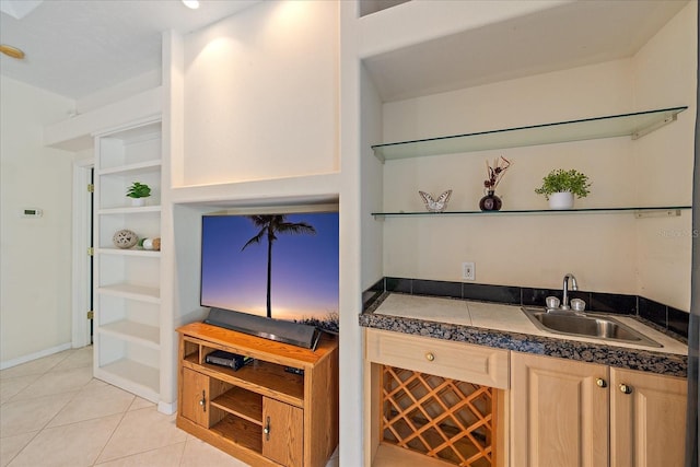 bar with light tile patterned floors and sink