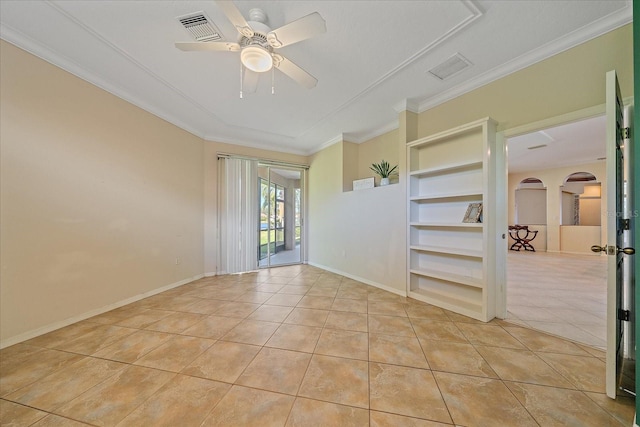 spare room with ceiling fan, light tile patterned floors, built in features, and crown molding