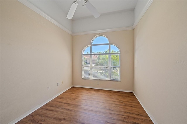 empty room with ceiling fan and hardwood / wood-style floors