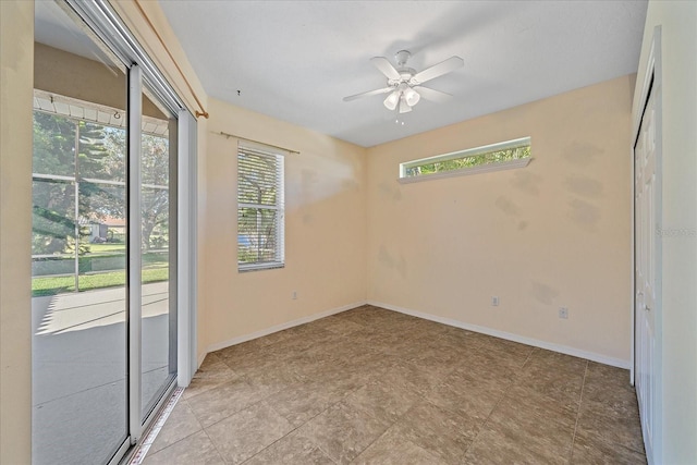 unfurnished room featuring ceiling fan and a healthy amount of sunlight