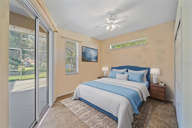 bedroom featuring ceiling fan, multiple windows, and light tile patterned flooring