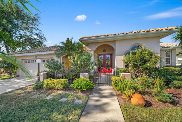 mediterranean / spanish house featuring a garage