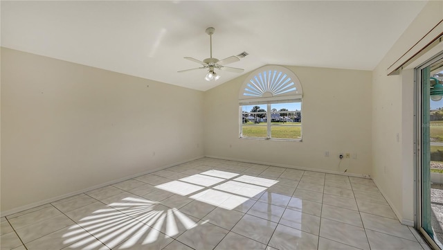 spare room with vaulted ceiling, ceiling fan, and light tile patterned flooring