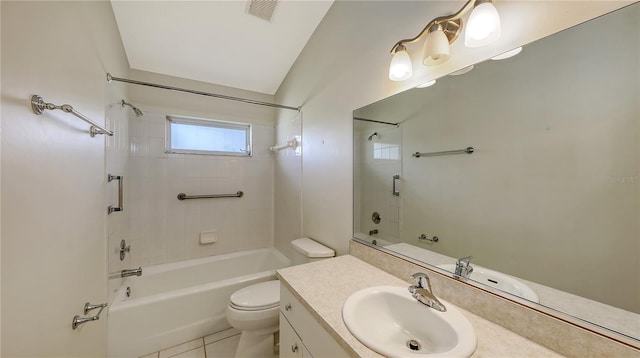 full bathroom featuring tile patterned floors, vanity, tiled shower / bath, and toilet