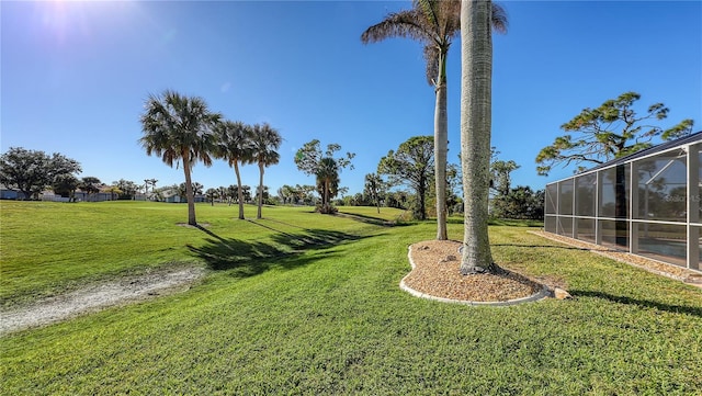 view of yard featuring a lanai