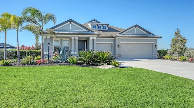 view of front of home with a garage and a front lawn