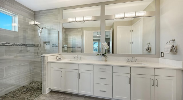 bathroom with vanity and an enclosed shower