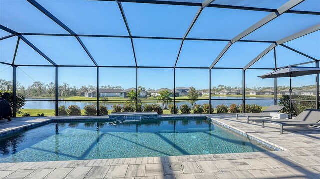 view of swimming pool with a water view, glass enclosure, and a patio area