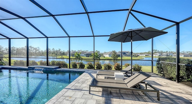 view of pool featuring glass enclosure, an in ground hot tub, a water view, and a patio