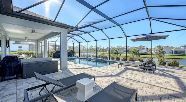 view of pool with an outdoor hot tub, glass enclosure, area for grilling, and a patio