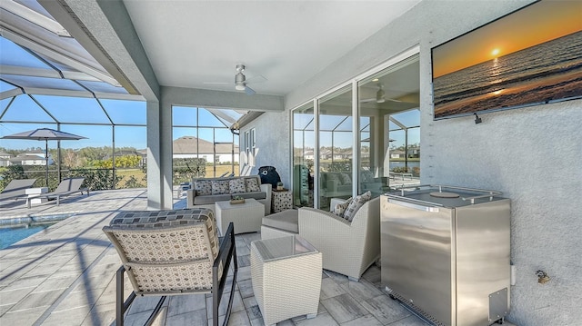 view of patio / terrace featuring a lanai, outdoor lounge area, and ceiling fan