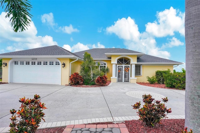 view of front of home with a garage