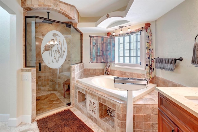 bathroom with tile patterned flooring, vanity, and independent shower and bath