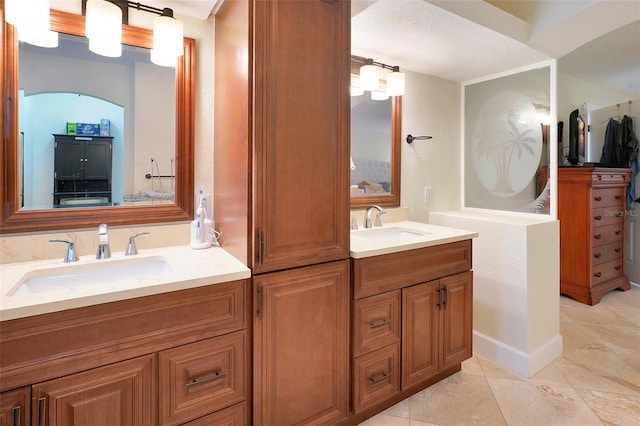 bathroom featuring vanity and a textured ceiling