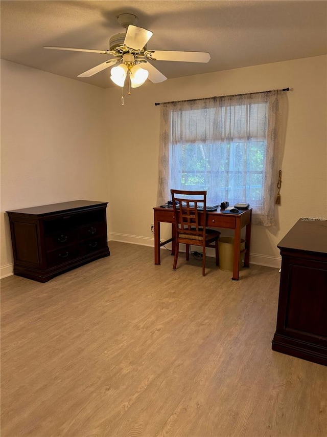 office space with ceiling fan and light wood-type flooring