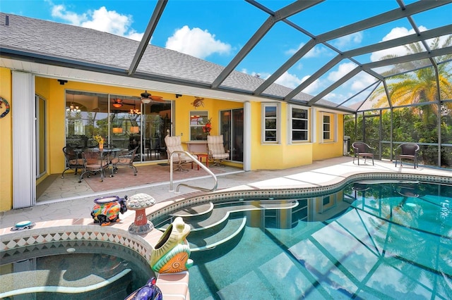 view of pool with a patio and glass enclosure