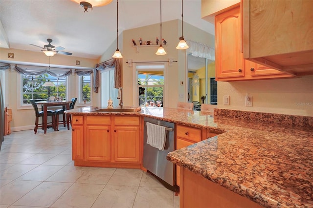 kitchen with light stone countertops, ceiling fan, sink, stainless steel dishwasher, and lofted ceiling