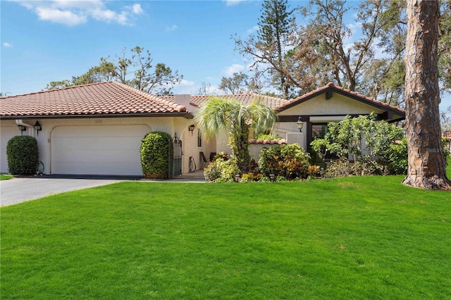 view of front facade featuring a front yard and a garage