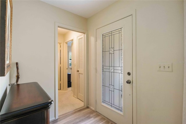 foyer with light hardwood / wood-style floors