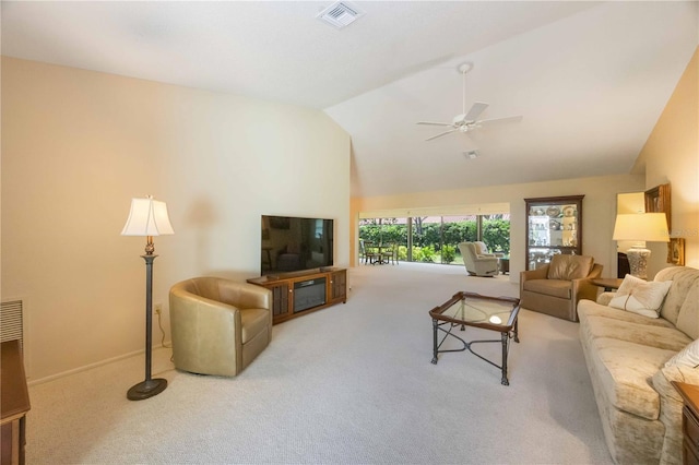 living room with ceiling fan, lofted ceiling, and light carpet